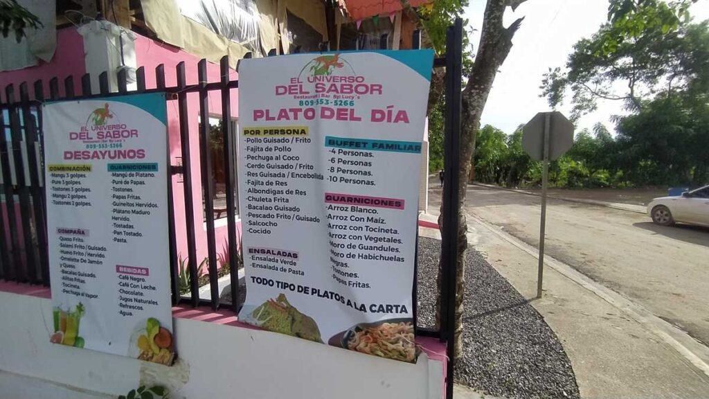 A menu from a local restaurant with typica l Dominican dishes, including breakfasts, side dishes, salads, drinks, and a la carte options.